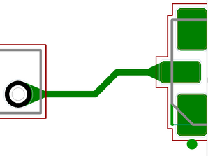 PCB layout close-up of two pads connected by a trace, showing teardrop-shaped copper fillets at the pad-to-trace junctions